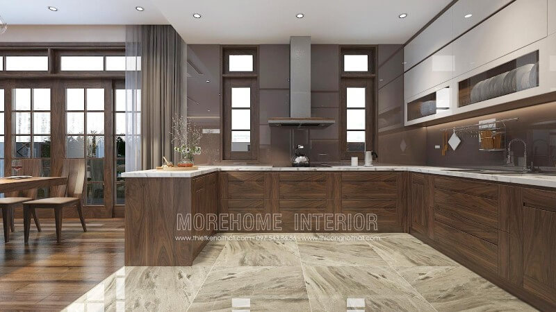 Mẫu tủ bếp màu nâu trầm ấn tượng từ gỗ óc chó, thiết kế liền bàn đảo hiện đại mang lại sự thuận tiện cho gia chủ trong quá trình nấu nướng và bày biện trang trí đồ ăn Thiết kế và sản xuất tủ bếp đẹp